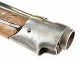 an old gun with a wooden handle on a white background