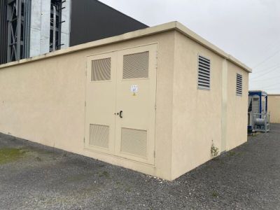 a small building with a door on the side of it