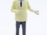 une figurine représentant un homme vêtu d'une veste jaune et d'une cravate