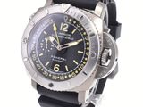 a black watch with yellow numbers on it on a white surface