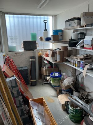a room filled with lots of clutter and boxes