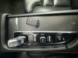 a cell phone in the center console of a car