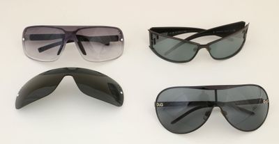 three pairs of sunglasses are shown on a white surface