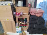 a pile of clothes and other items on a table