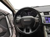 the interior of a car with a steering wheel and dashboard controls
