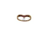 a close up of a gold ring with purple stones on it