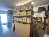 a room with a lot of boxes and boxes on the shelves