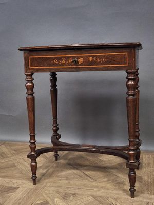 an old wooden table with a drawer on top of it