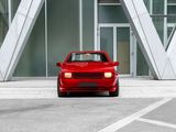 a red car that is parked in front of a building