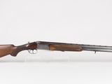 a rifle with a wooden barrel on a white background