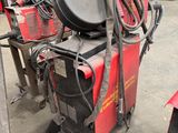 a machine that is sitting on a cart in a warehouse