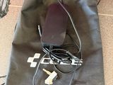 a bag that has a remote and a charger on it