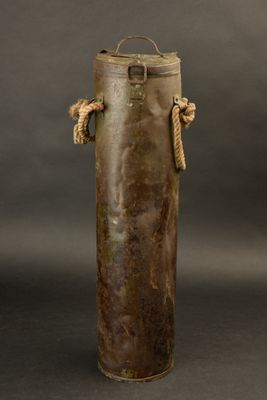 an image of an old metal bottle with rope handles