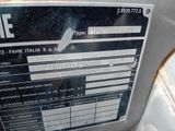a label on the side of a machine that is sitting on the ground