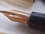 a close up of a fountain pen and a pen nib
