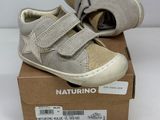 baby boy ' s shoes in a box on a white surface