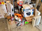 a pile of assorted items sitting on the floor
