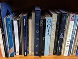 many books that are on a shelf in a book case