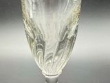 a glass that is sitting on a table with a black background