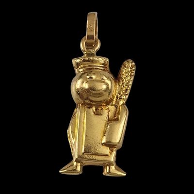 a close up of a gold pendant of a person holding a baseball bat