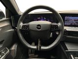 the interior of a car with a steering wheel and dashboard controls
