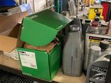 a shelf full of assorted items in a garage