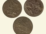 three different coins are shown on a white surface with a white background