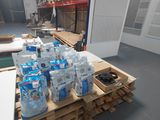 a pallet full of bottled water on a pallet in a warehouse