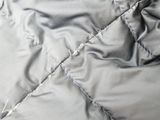 an image of a close up of a quilted jacket