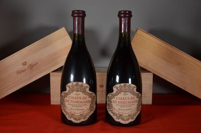 two bottles of wine sitting next to each other on a table