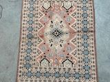 an old rug with fringes and fringes on the ground