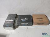 three boxes of sensky are lined up on a white surface