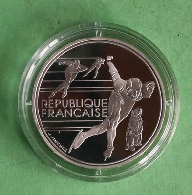 a close up of a coin with a baseball player on it