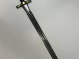 a sword with a black handle on a white surface