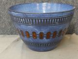 a blue bowl that is sitting on a table