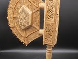 a close up of a wooden object with a bird on it