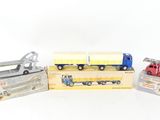 three toy trucks that are sitting next to each other