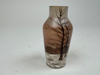 a vase that has a picture of a tree on it