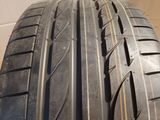 a close up of a car tire on a wooden floor