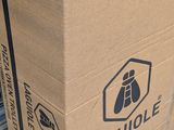a cardboard box that is sitting on a metal rack