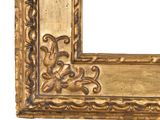 an antique gold frame with a decorative design on the outside of it