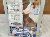 a box with a picture of a woman holding a baby