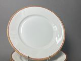 four plates stacked on top of each other on a table