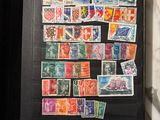 a picture of a book with stamps and coins on it