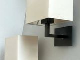 two lamps that are on the wall next to each other