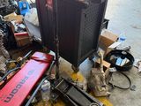 a pile of junk on the ground next to a truck