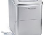 a close up of a small ice cream maker on a white surface
