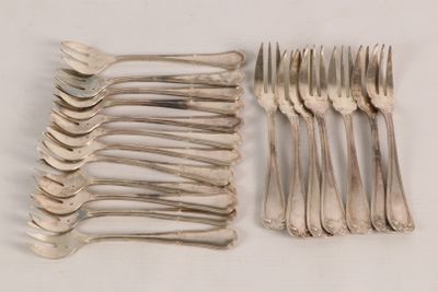 a lot of forks and spoons sitting on a table