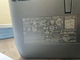 a close up of a laptop on a wooden table