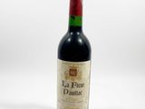 a bottle of wine that is sitting on a table